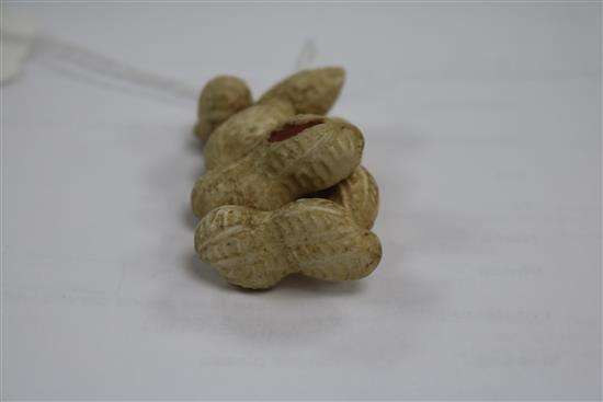 A Japanese Meiji period carved ivory group of peanuts, 5.5cm